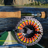Buy canvas prints of Close up of a fly fishing rod and reel in the late evening sun by SnapT Photography