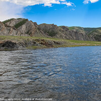 Buy canvas prints of A fast river in Mongolia, with mountains and blue sky by SnapT Photography