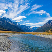 Buy canvas prints of The upper Ahuriri River on a sunny day, surrounded by snow capped mountains by SnapT Photography