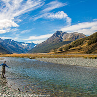 Buy canvas prints of A fly fisherman casting for trout on the Ahuriri River in New Zealand by SnapT Photography