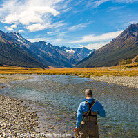 Buy canvas prints of An fly fisherman looking for trout in the mountains of the Ahuriri River by SnapT Photography