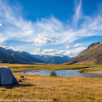 Buy canvas prints of A tent pitched beside a river, surrounded by mountains, in New Zealand by SnapT Photography