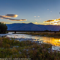 Buy canvas prints of Sunset on the Tekapo River, with mountains in the background in summer by SnapT Photography
