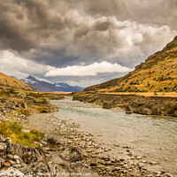 Buy canvas prints of A mountain landscape and river on a cloudy day in New Zealand near Omarama by SnapT Photography