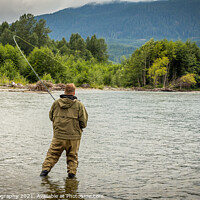 Buy canvas prints of Fisherman battling a fish with a bent rod, while wading. by SnapT Photography
