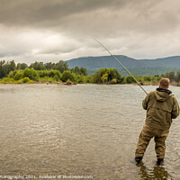 Buy canvas prints of Fisherman battling a fish with a bent rod, while wading. by SnapT Photography