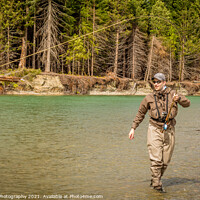 Buy canvas prints of A sport fly fisherman hooked into a salmon on a river in British Columbia by SnapT Photography