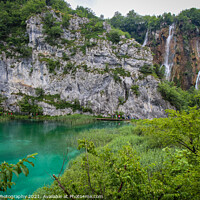 Buy canvas prints of A large waterfall flowing over a mountain into a lake at Plitvice Lakes, Croatia by SnapT Photography