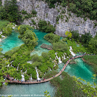 Buy canvas prints of A series of waterfalls and tourists at Plitvice Lakes, Croatia by SnapT Photography