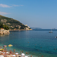 Buy canvas prints of A view over Plaza Banje beach along Dubrovnik's adriatic coast, Croatia by SnapT Photography