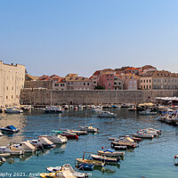 Buy canvas prints of A view over Dubrovnik harbour and the old town on a summer afternoon, Croatia by SnapT Photography