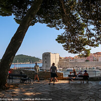 Buy canvas prints of Tourists viewing the harbour and old town in Dubrovnik, Croatia by SnapT Photography