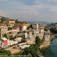 Buy canvas prints of View over the old town of Mostar and the old bridge over the Neretva River by SnapT Photography