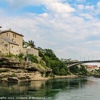 Buy canvas prints of The green Neretva River underneath the old bridge in Mostar, Bosnia by SnapT Photography