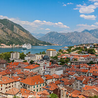 Buy canvas prints of The old town of Kotor by the sea at Kotor Bay, Montenegro by SnapT Photography