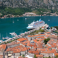 Buy canvas prints of A cruise ship moored at the UNESCO World Heritage Site of the Old Town of Kotor by SnapT Photography