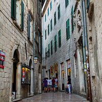 Buy canvas prints of A narrow street in the Old Town of Kotor, with Medieval architecture by SnapT Photography