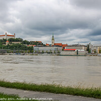 Buy canvas prints of A view across the River Danube of Bratislava and Castle, Slovakia by SnapT Photography