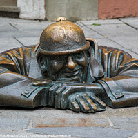 Buy canvas prints of The 'Man at Work' statue called Cumil, in Bratislava's old town, Slovakia by SnapT Photography