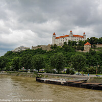 Buy canvas prints of Bratislava Castle over looking the River Danube in the old town, Slovakia by SnapT Photography