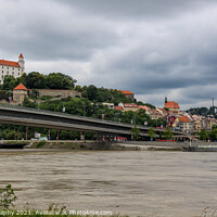 Buy canvas prints of Bratislava Castle over looking the River Danube and the Most SNP Bridge by SnapT Photography