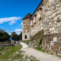 Buy canvas prints of The outer wall and watch tower on Ljubljana Castle / Ljubljanski grad, Ljubljana by SnapT Photography