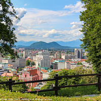 Buy canvas prints of A view over Ljubljana to the mountains from the view point at Ljubljana Castle by SnapT Photography