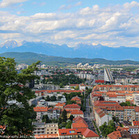 Buy canvas prints of A view over Ljubljana to the mountains from the view point at Ljubljana Castle by SnapT Photography