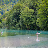 Buy canvas prints of Two fly fisherman fishing for Marble Trout on the Soca River at Tolmin, Slovenia by SnapT Photography