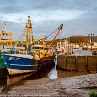 Buy canvas prints of Fishing trawlers moored at Kirkcudbright harbour on the River Dee at sunset by SnapT Photography