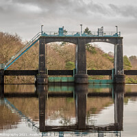 Buy canvas prints of Flood gates reflecting on Earlstoun Loch at Earlstound Dam by SnapT Photography