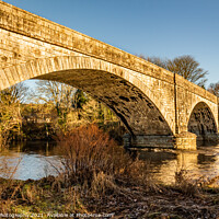 Buy canvas prints of The arched Ken Bridge over the Water of Ken on a sunny winters day, Scotland by SnapT Photography