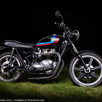 Buy canvas prints of Classic Triumph at night by James Catley