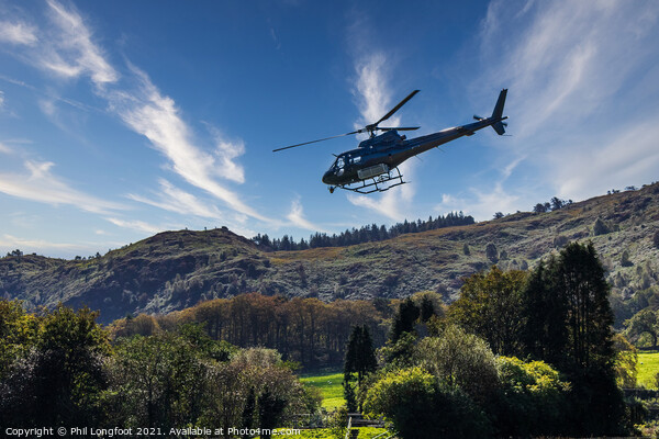 Helicopter flying low at Beddgelert Snowdonia  Picture Board by Phil Longfoot