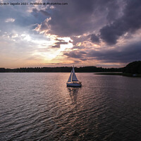 Buy canvas prints of Sailing boat with a beautiful sunset by Wojciech Jagoda