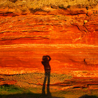 Buy canvas prints of Photographer's Shadow on Sandstone Cliff by Ron Thomas