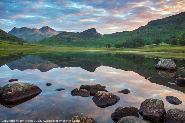 Sunrise at Blea Tarn Picture Board by Jim Monk