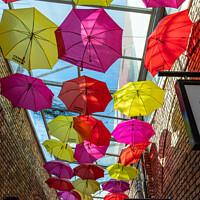 Buy canvas prints of Camden Market Umbrellas by Jim Monk