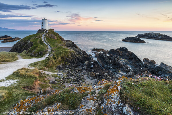 Sunset at Llanddwyn Island Lighthouse Picture Board by Jim Monk