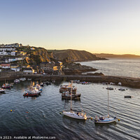 Buy canvas prints of First light at Mevagissey Harbour by Jim Monk
