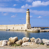 Buy canvas prints of Rethymno Harbour and Lighthouse, Crete by Jim Monk