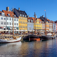 Buy canvas prints of Nyhavn canal and promenade, Copenhagen by Jim Monk