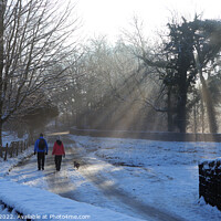 Buy canvas prints of Walkers on a winters day. by Glyn Evans