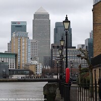 Buy canvas prints of Canary Wharf from Thames Walkway London England by ANN RENFREW