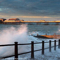 Buy canvas prints of Cromer pier sunset with crashing waves 917 by PHILIP CHALK