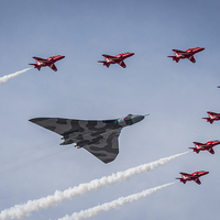 Buy canvas prints of Vulcan XH558 and The Red Arrows by Jeni Harney