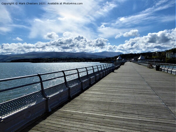 Bangor pier looking towards Snowdonia. Picture Board by Mark Chesters