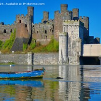 Buy canvas prints of Beautiful Conwy Castle and boats on a February day by Mark Chesters