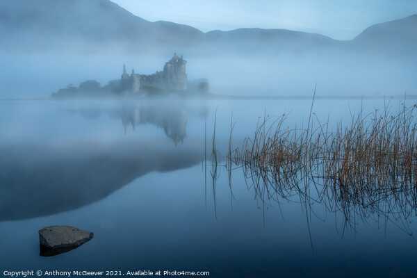 A misty sunrise on Kilchurn Castle  Picture Board by Anthony McGeever