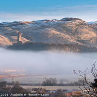 Buy canvas prints of Wallace Monument and snow capped Ochil Hills  by Anthony McGeever